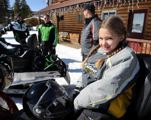 A girl on a snowmobile